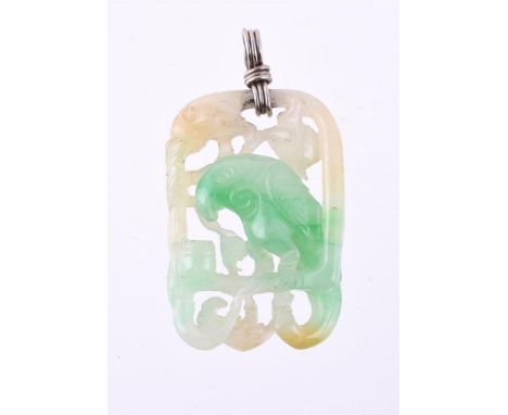 
	
		A CARVED JADEITE PARROT PENDANT
		The pierced carved and polished parrot sitting on a stand within a floral border, with