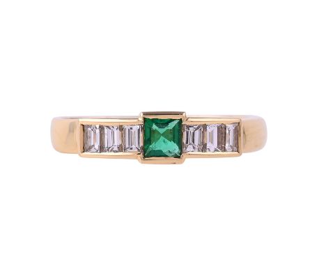 
	
		AN 18 CARAT GOLD DIAMOND AND EMERALD SEVEN STONE RING 
		LONDON 1994
		The central step cut emerald flanked by two trios