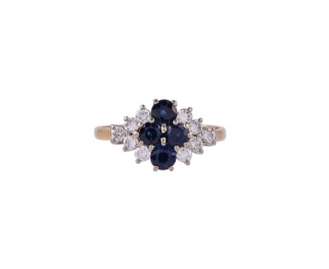 
	
		AN 18 CARAT GOLD, SAPPHIRE AND DIAMOND CLUSTER RING 
		LONDON 1985
		The cluster centred with four circular cut sapphire