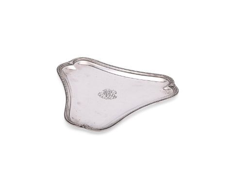 
	
		A FRENCH SILVER TREFOIL SHAPED TRAY
		MAISON ODIOT, CIRCA 1920
		With a beaded border and engraved with a monogram
		26.