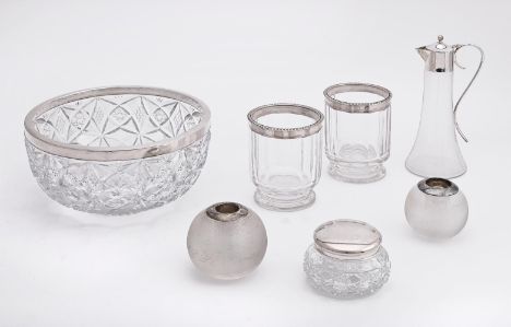 
	
		A COLLECTION OF SILVER MOUNTED ITEMS
		To include: a silver mounted ewer by Asprey, London 1994, with a ball finial to t