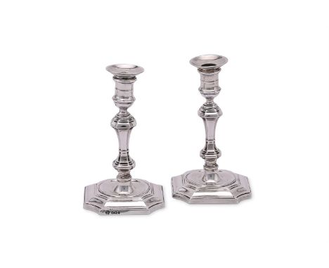 
	
		A PAIR OF EDWARDIAN SILVER TAPERSTICKS
		HAWKSWORTH, EYRE &amp; CO. LTD., SHEFFIELD 1901 AND 1902
		With circular sconce