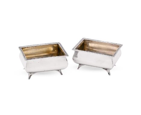 
	
		A PAIR OF GEORGE III OBLONG SALT CELLARS
		THOMAS WHIPHAM, LONDON 1806
		With gadrooned borders and on four bracket feet
