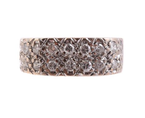 
	
		TWO ROW DIAMOND RING 
		LONDON 1978
		The two rows of brilliant cut diamonds in textured settings, approximately 0.54 ca