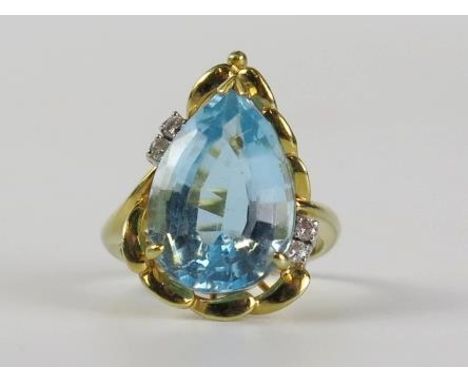 14ct Gold, Blue Topaz and Diamond Ring, the pear shaped central stone 10.7ct, size N.5, 8.3g, boxed 