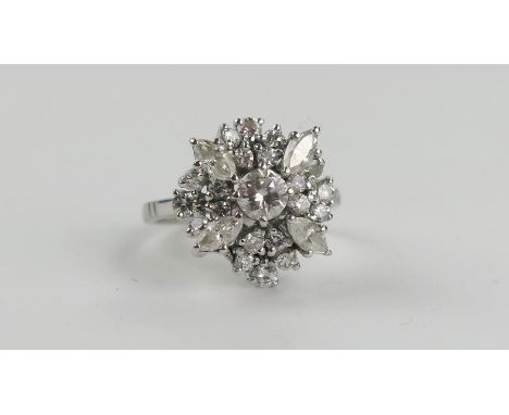 Bespoke 18ct White Gold and Diamond Cluster Ring, the central round cut 4.5mm stone surrounded by for marquise cut stones and