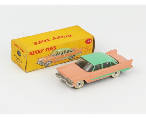 A Dinky Toys 178 Plymouth Plaza in salmon pink with light green roof and flash, spun hubs and mottled base in correct colour 