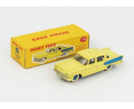 A Dinky Toys 179 Studebaker President Sedan in light yellow with blue flash and hubs in correct colour spot type 1 picture bo