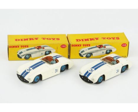 Two Dinky Toys 133 Cunningham C-5R Road Racers in white with dark blue stripes, brown interior, light blue driver and blue hu