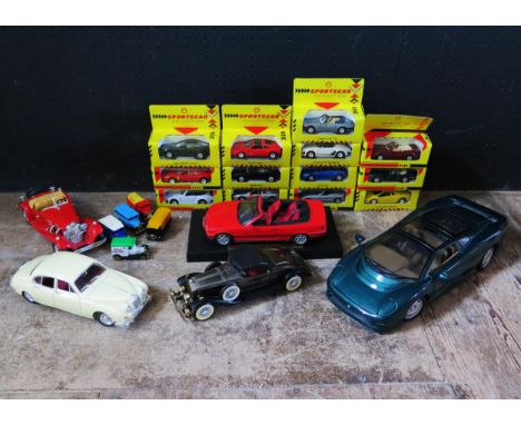 A Collection of Boxed and Loose Diecast Including MC Toys Shell Promotional Sports Cars, Maisto 1:12 Jaguar XJ220, 1:18 Scale