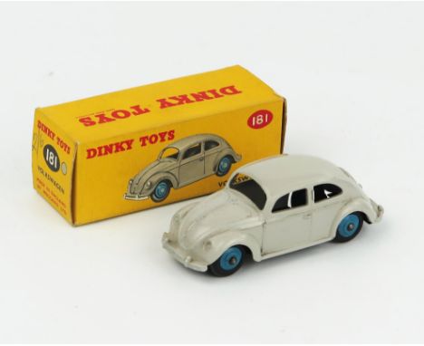 A Dinky Toys 181 Volkswagen (Beetle) in light grey with mid blue hubs in correct colour spot type 1 picture box. Near mint (s