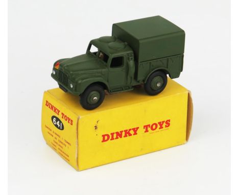 A Dinky Toys 641 Army 1 Ton Cargo Truck with driver, no windows in non-picture. Very near mint  in excellent box with pen pri