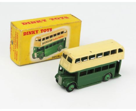 A Dinky Toys 29c 290 Double Deck Bus with Type 2 AEC grille, dark green/cream with green hubs and no advertisement in correct