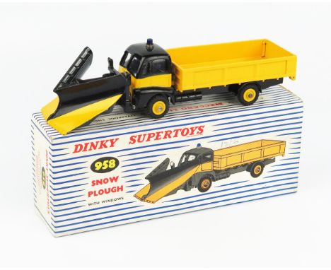 A Dinky Supertoys 958 Snow Plough in black and yellow  with matching plough blade, blue light and yellow grooved hubs in blue