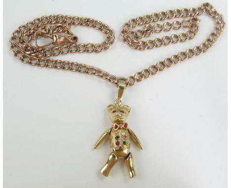 9ct Gold, Emerald and Ruby Bear Pendant with articulated head, arms and legs (c. 43mm drop) and on an old 18" 9ct gold curb l