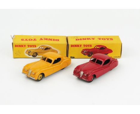 Two Dinky Toys 157 Jaguar XK120 Coupes one in yellow with light yellow hubs, one in red with red hubs both in correct type 1 