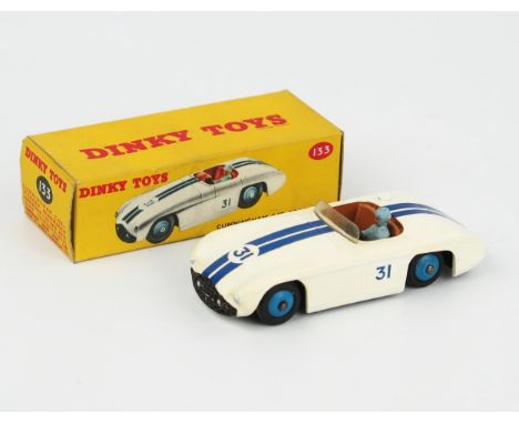 A Dinky Toys 133 Cunningham C-5R Road Racer in white  with dark blue stripes, brown interior, light blue driver and blue hubs