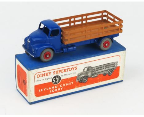 A Dinky Supertoys 531 Leyland Comet Lorry with Stake Body in dark blue with brown back, red hubs and grey tyres in blue box w