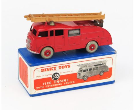 A Dinky Toys 555 (Commer) Fire Engine with Extending Ladder in red with tan ladder, no windows, red hubs and grey tyres in bl