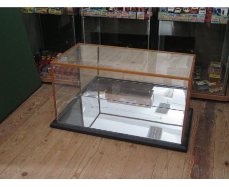 A Wooden Framed Glass Collector's Display Case for Large Scale Model Cars or similar with mirrored base and back (overall mea