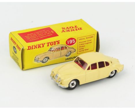 A Dinky Toys 195 Jaguar 3.4 Saloon in cream with red interior, spun hubs and gloss black base in light yellow picture box wit