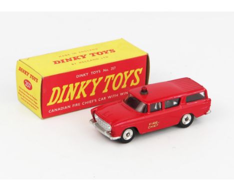 A Dinky Toys 257 Nash Rambler Canadian Fire Chief's Car in red with red light and spun hubs in red/yellow non-picture box. Ex