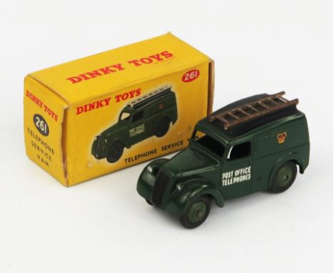 A Dinky Toys 261 Telephone Service Van (Morris Z) in dark green with black roof, dark green and  unpainted ladder (rusty). Ne