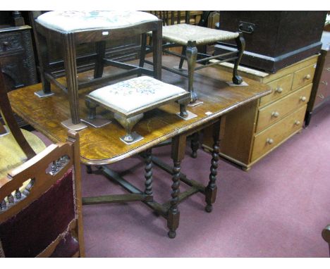 A 1920's Oak Gate Leg Table, with drop leaves on barley twist supports.