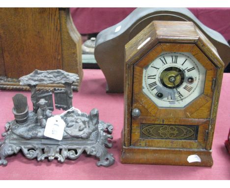 A Circa 1900 American Shelf Clock, painted dial, Roman numerals, height 23cm, and a cast metal novelty ink and match stand, m