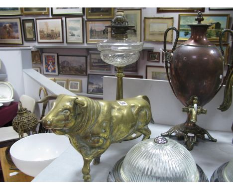A XIX Century Circular Brass Oil Lamp, having glass well; brass bull 46cm long.