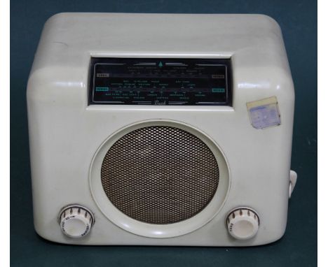 A vintage Bush cream bakelite radio.