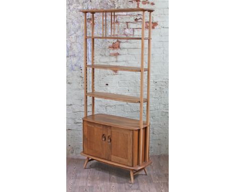 An Ercol blonde elm and beech room divider or bookcase with lower cupboard, width 86cm, depth 40.5cm & height 192cm. CONDITIO