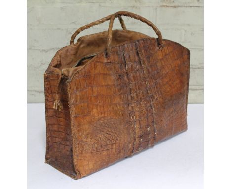 A vintage crocodile skin hand bag, length 52cm. CONDITION REPORT - general wear to include scuffs and minor damage to seems.