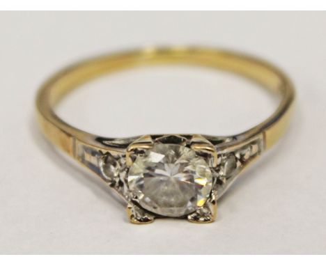 A hallmarked 9ct gold ring set with centre clear stone, gross wt. 2.3g, size R.