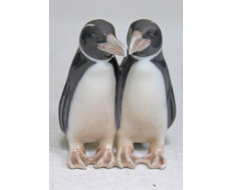 A Royal Copenhagen porcelain model formed as a pair of penguins, height 9.5cm. CONDITION REPORT - very good, no damage, littl
