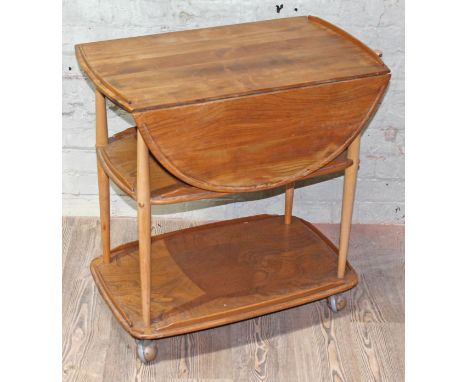 An Ercol blonde elm and beech trolley, length 73cm, depth 46cm & 76cm.