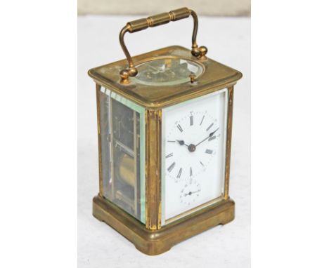 A brass carriage clock, height 16cm.