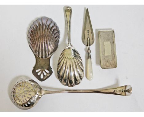 Hallmarked silver comprising two caddy spoons, a sifting spoon and a trowel bookmark, together with a white metal money clip.