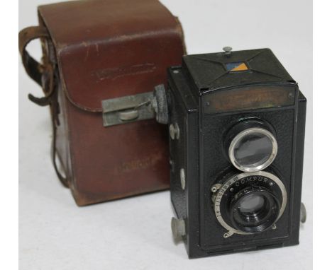 A Voitlander Brilliant camera with leather case.