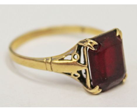 A hallmarked 9ct gold ring set with a ruby coloured stone, gross wt. 1.6g, size N.