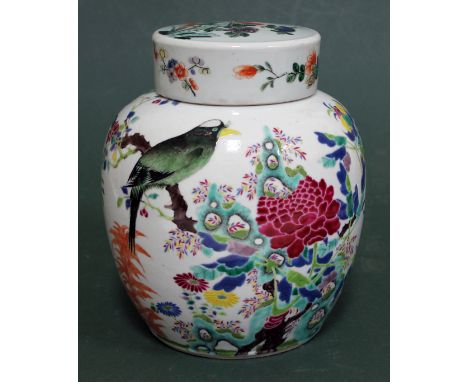 A Chinese porcelain ginger jar with cover decorated in over enamels with a bird amongst a flowering tree, blue six character 