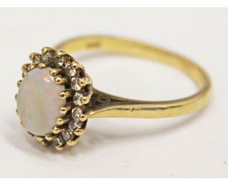 A hallmarked 9ct gold opal cabochon ring, gross wt. 2.8g, size M.