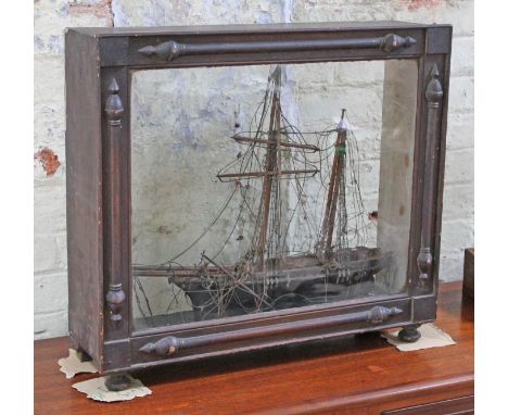 A 2 master model sailing ship within a Victorian scrumble pine display glass, 71cm x 63cm.