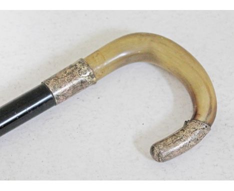 A hallmarked silver mounted and horn handled walking stick, length 85cm.