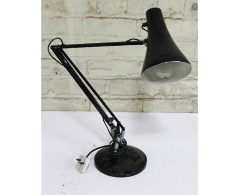 A black anglepoise lamp.