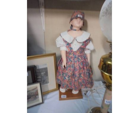 A good porcelain collector's doll.