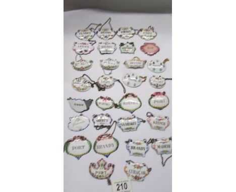 Twenty enamel decanter labels. 