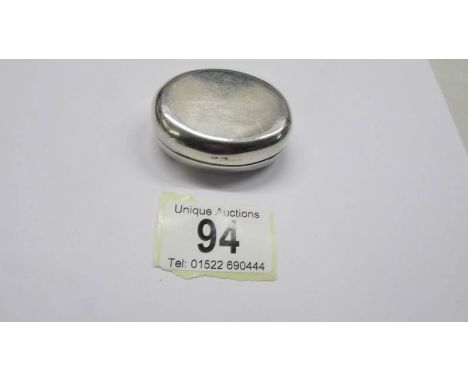 A oval silver trinket box, circa 1897.