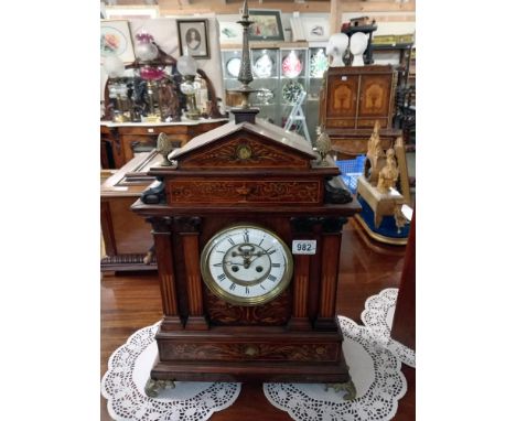 A marquetry inlaid open escapement mantel clock. 