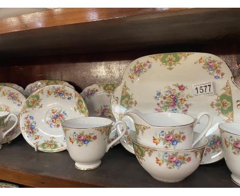 A 21 piece Windsor tea set (Middle shelf)Marks consistent with age 